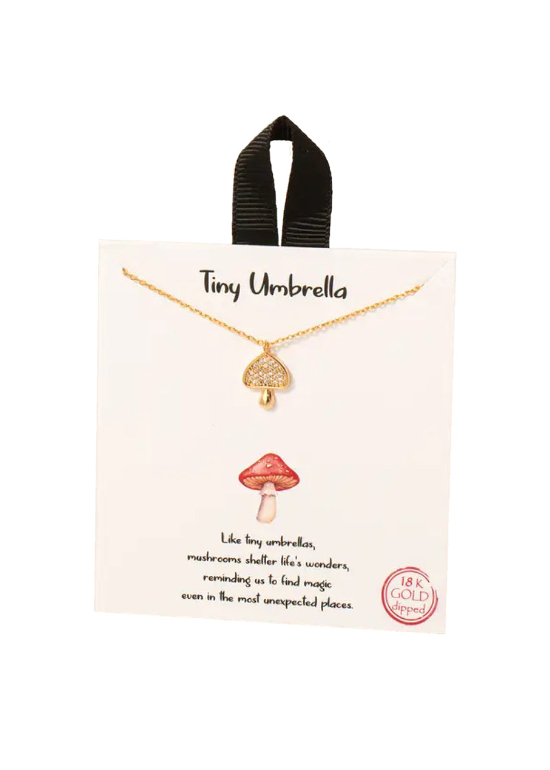 Gold chain necklace with gold mushroom pendant.