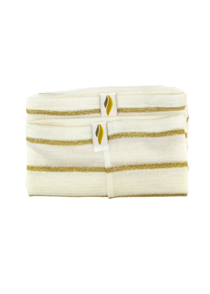 A folded pair of cream-colored legwarmers with thin, gold, horizontal stripes.