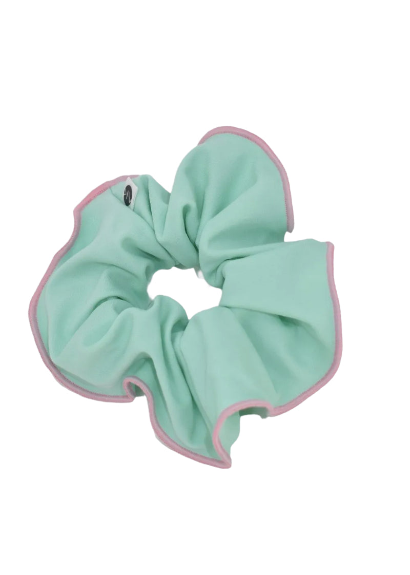 AK Dancewear scrunchie in light blueish green with pink trim.