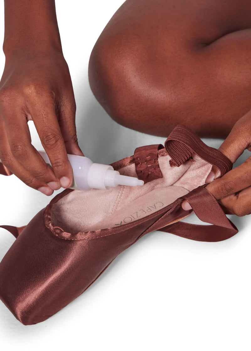 Photo of a model demonstrating reinforcing her pointe shoes using the BH1710 Capezio Bunheads Shoe Glue