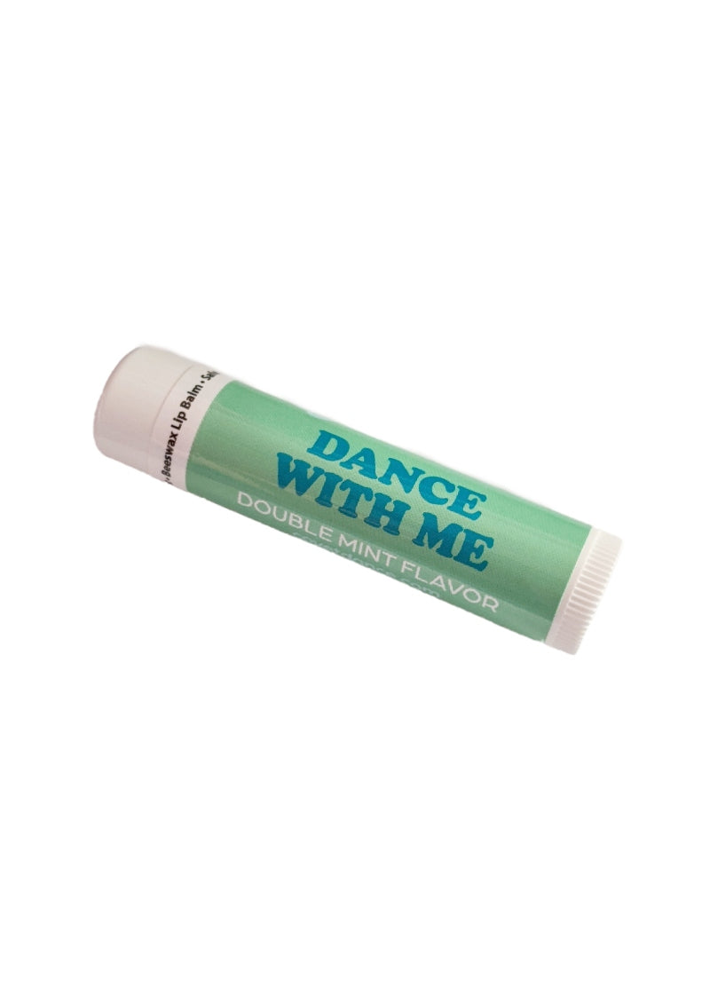 Green tube of lip balm with text "DANCE WITH ME."
