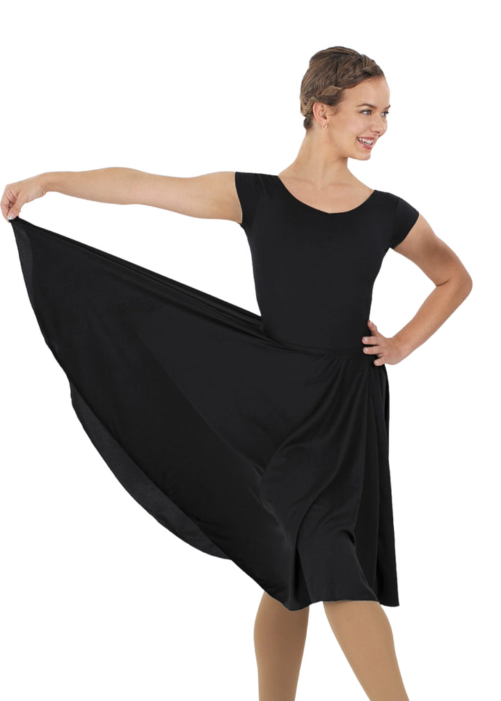 Eurotard 13774 Eurotard Womens Polyester Pull On Character Skirt in Black, shown on a model holding the hem of the skirt out to the side, showcasing that it is a full circle skirt