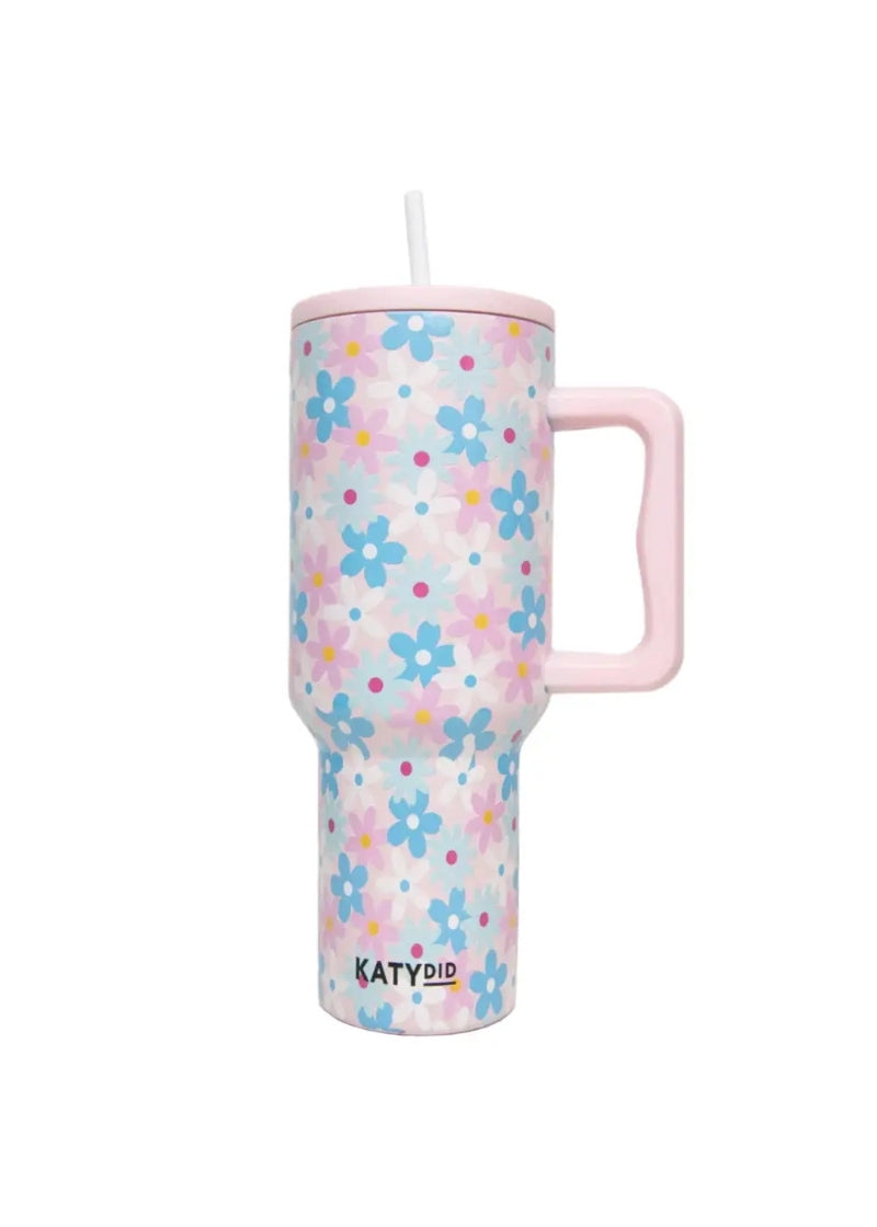 light pink tumbler with straw, handle, and pastel flower pattern