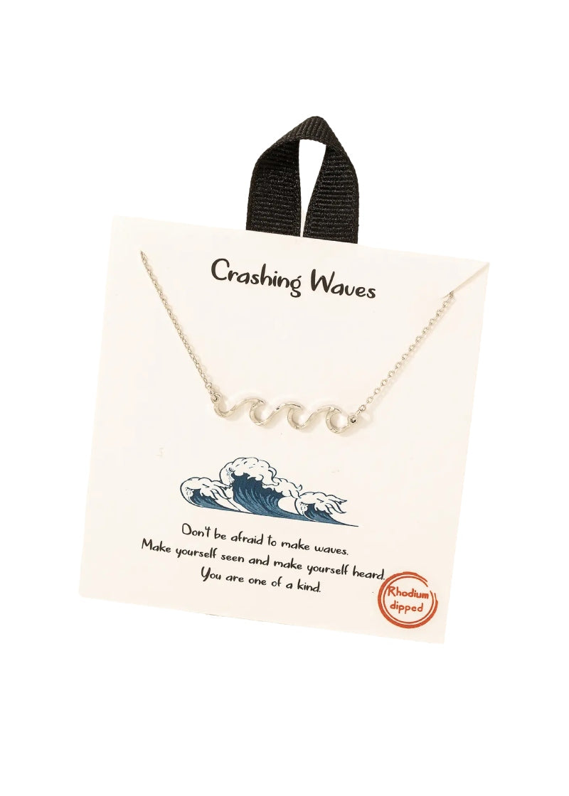 silver necklace with stationary wave pendant pictured on cardstock packaging