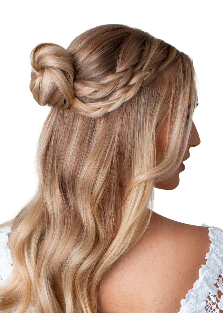 A model with blonde hair demonstrating the use of Frenchies Hair Pins in Blonde for creating an elegant half-up half-down hairstyle