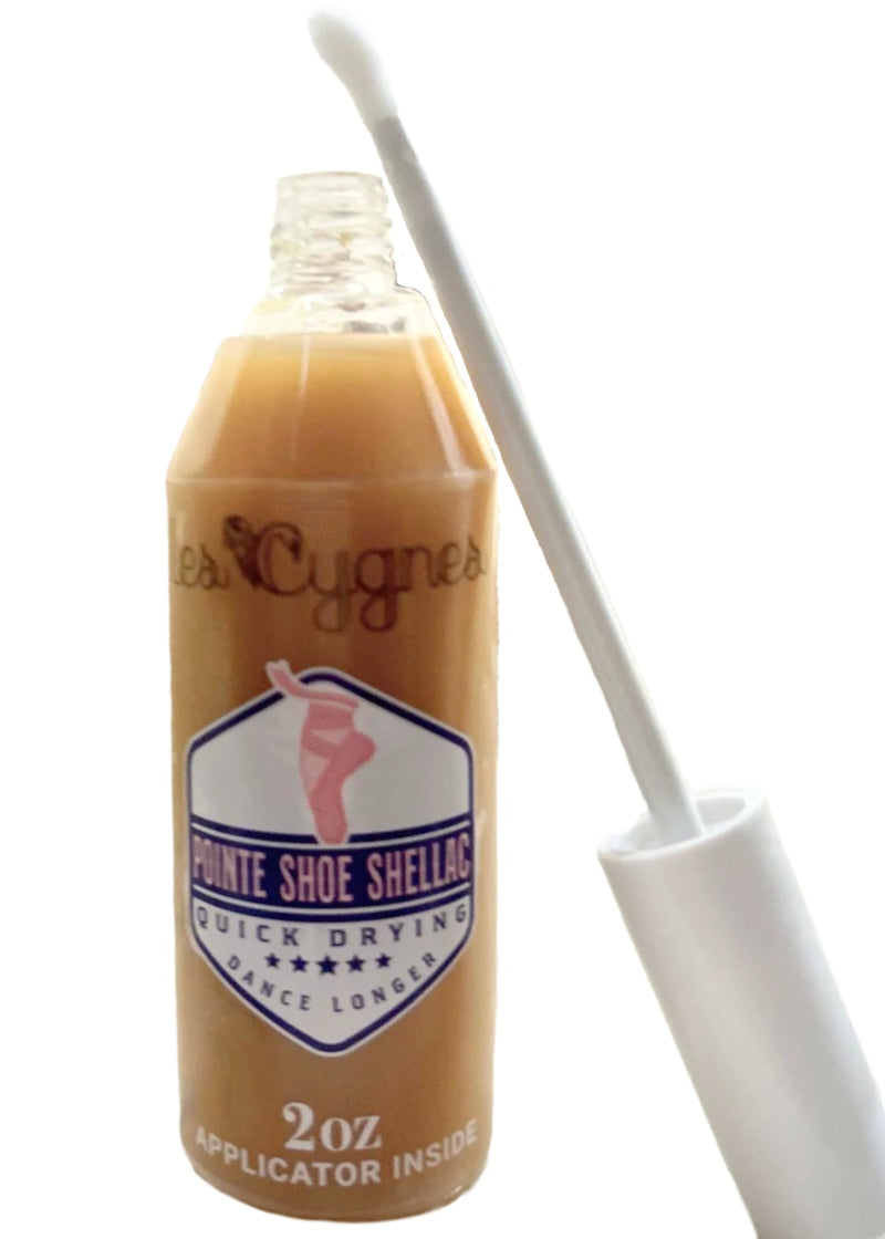 2 ounce bottle of Les Cygnes Quick-Drying Pointe Shoe Shellac for Reinforcing Your Pointe Shoes Including the Convenient 5 Inch Applicator Wand