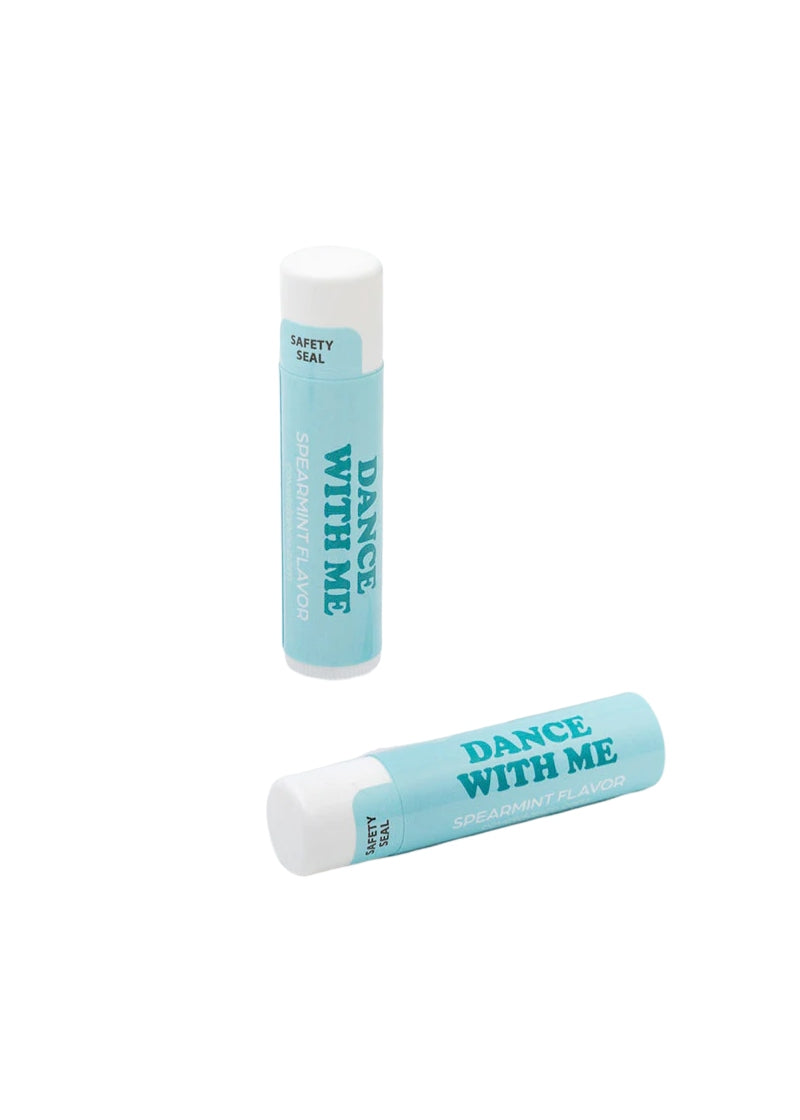 Two light blue tubes of lip balm with text "DANCE WITH ME."