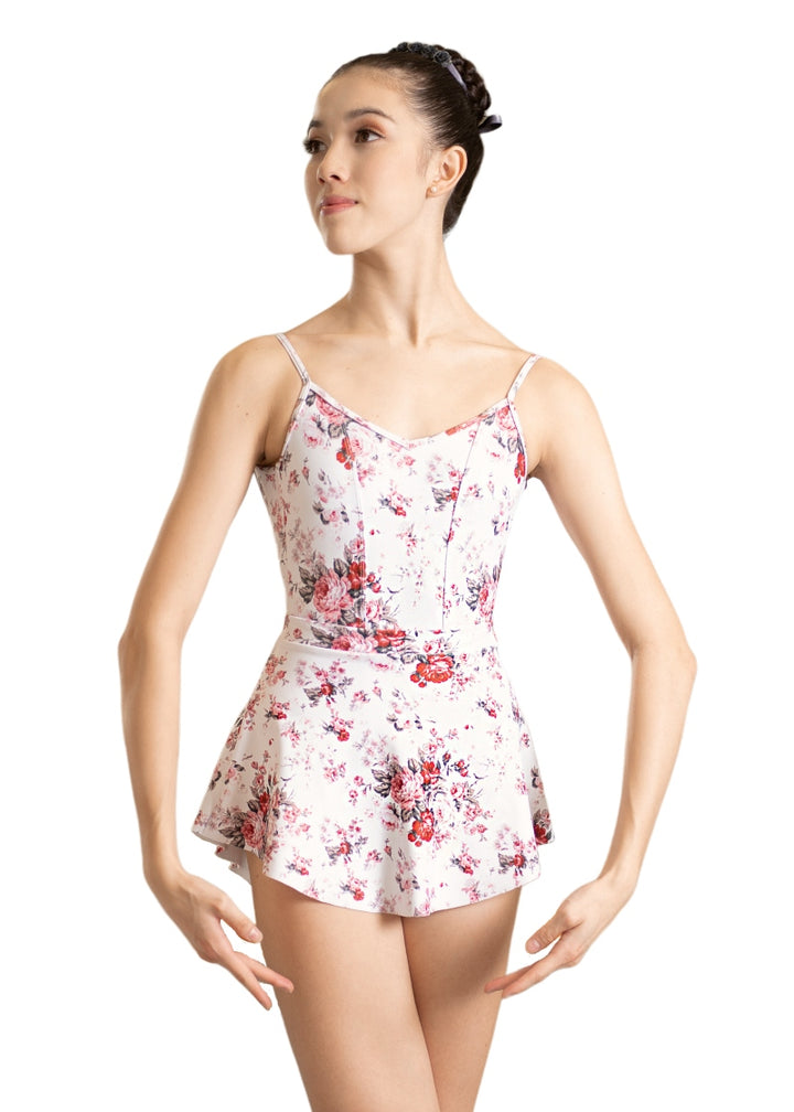 Danse De Paris Jardin camisole leotard with red rose pattern, V neckline, and princess seams. Pictured with matching pull-on skirt.