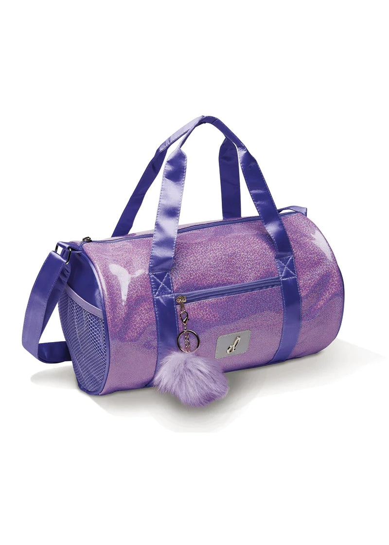 Glittery lavender duffel bag with purple accents and handles, with a poof keychain on the zipper and a silver logo on the front.