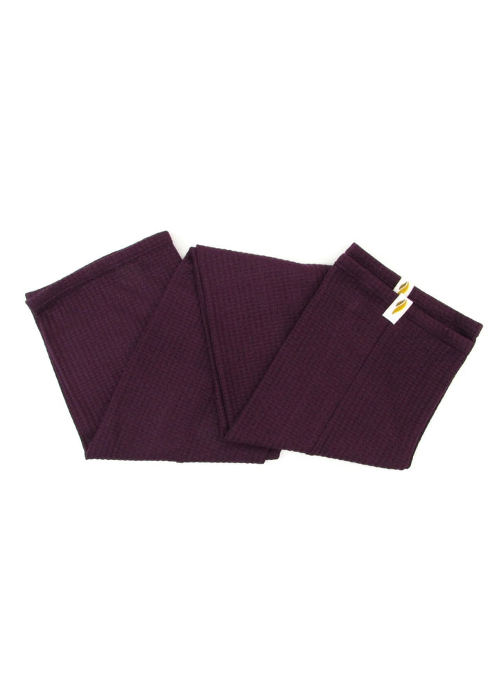 A pair of dark reddish-purple legwarmers.