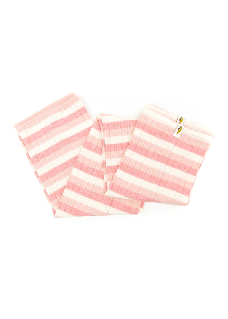 Knit legwarmers with horizontal stripes of three different shads of light pink.