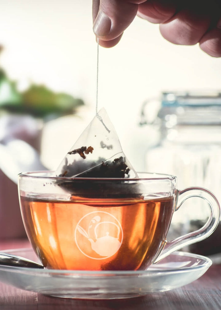 Tea steeping in a clear teacup.