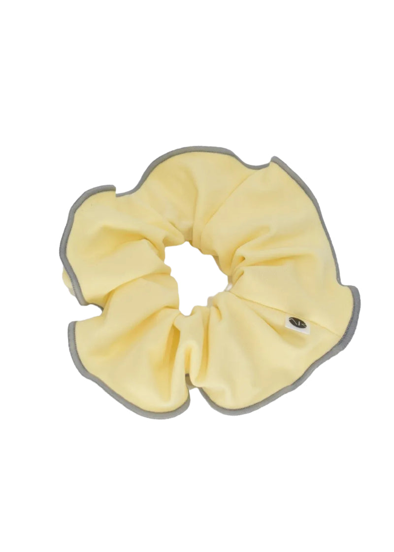 AK Dancewear scrunchie in yellow with grey trim.