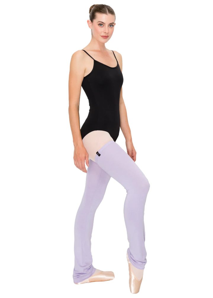 Photo of model en pointe wearing ultra soft Aluvie AL005 full-length modal legwarmers in Lilac, a light purple color