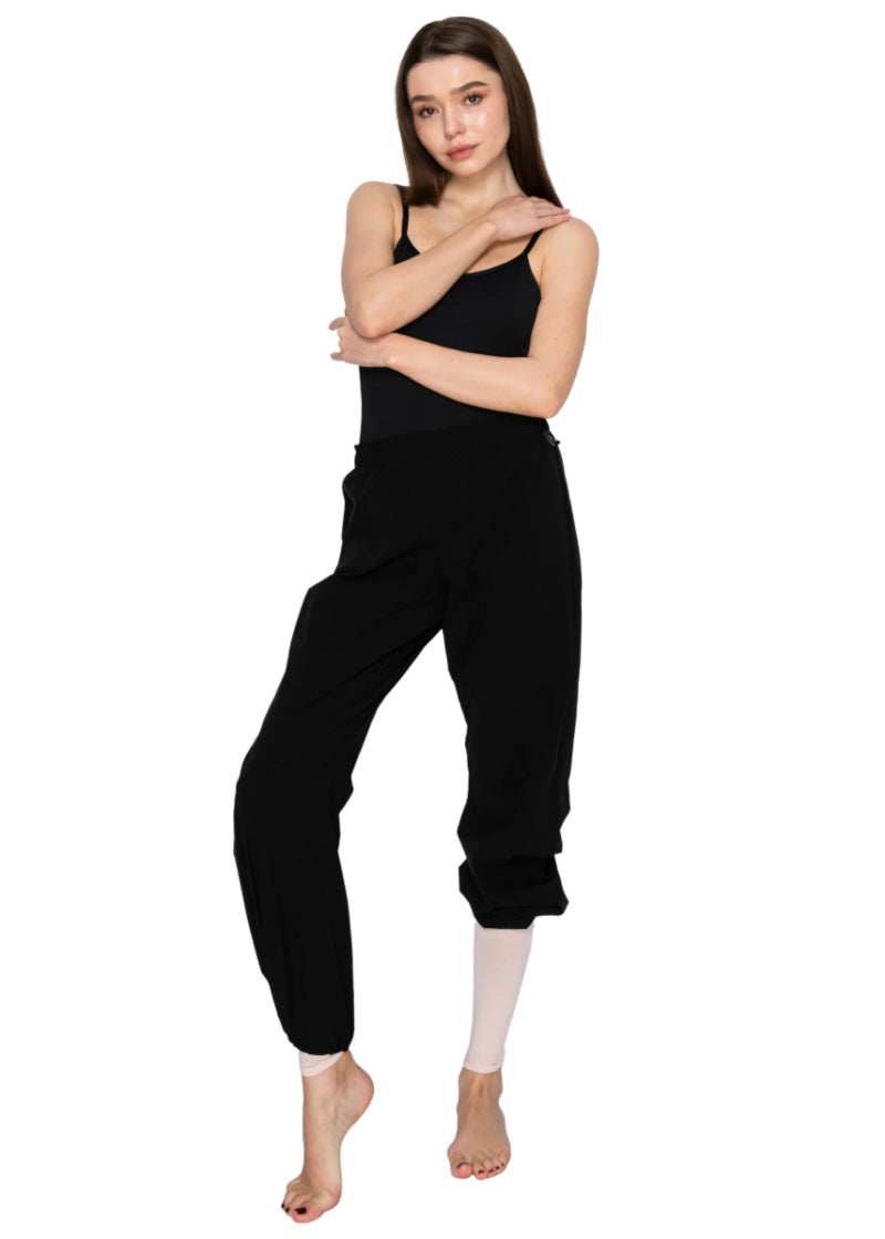 Aluvie women's Bree pants in black with cinched waistband and drawstring hems.