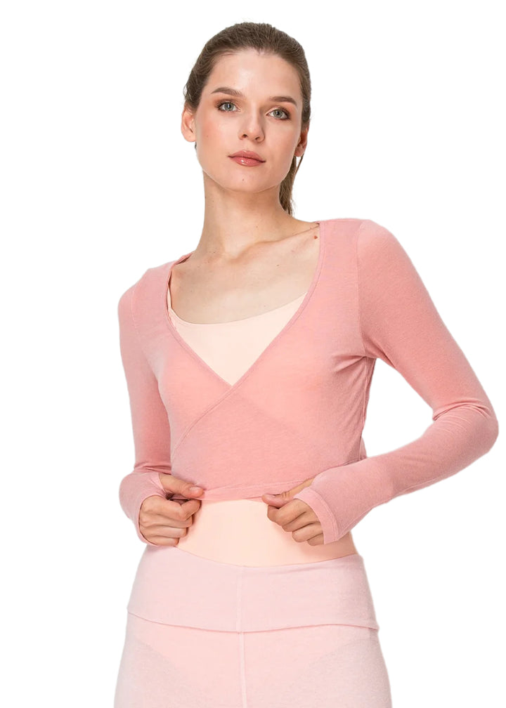 Photo of model wearing the Aluvie AW002 Rhi Wrap Sweater in Peach Pink, a medium pink color, made from a super soft blend of tencel and wool