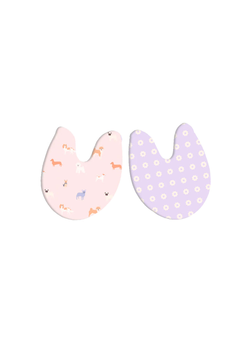 Toe pads with dog print on pink background on one side and pink circles on purple background on the other side.