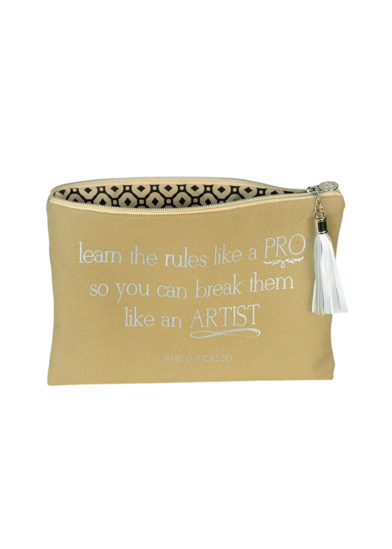 Tan canvas accessory bag with zipper closure and silver tassel, with "learn the rules like a PRO so you can break them like an ARTIST" printed in silver.
