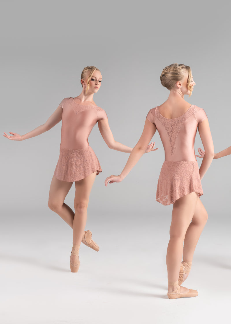 Ballet Rosa 1323LBA Women's Colette Cap Sleeve Leotard in Pearl peachy pink with lace V-neckline, modeled by a ballet dancer wearing the matching Jolie Skirt