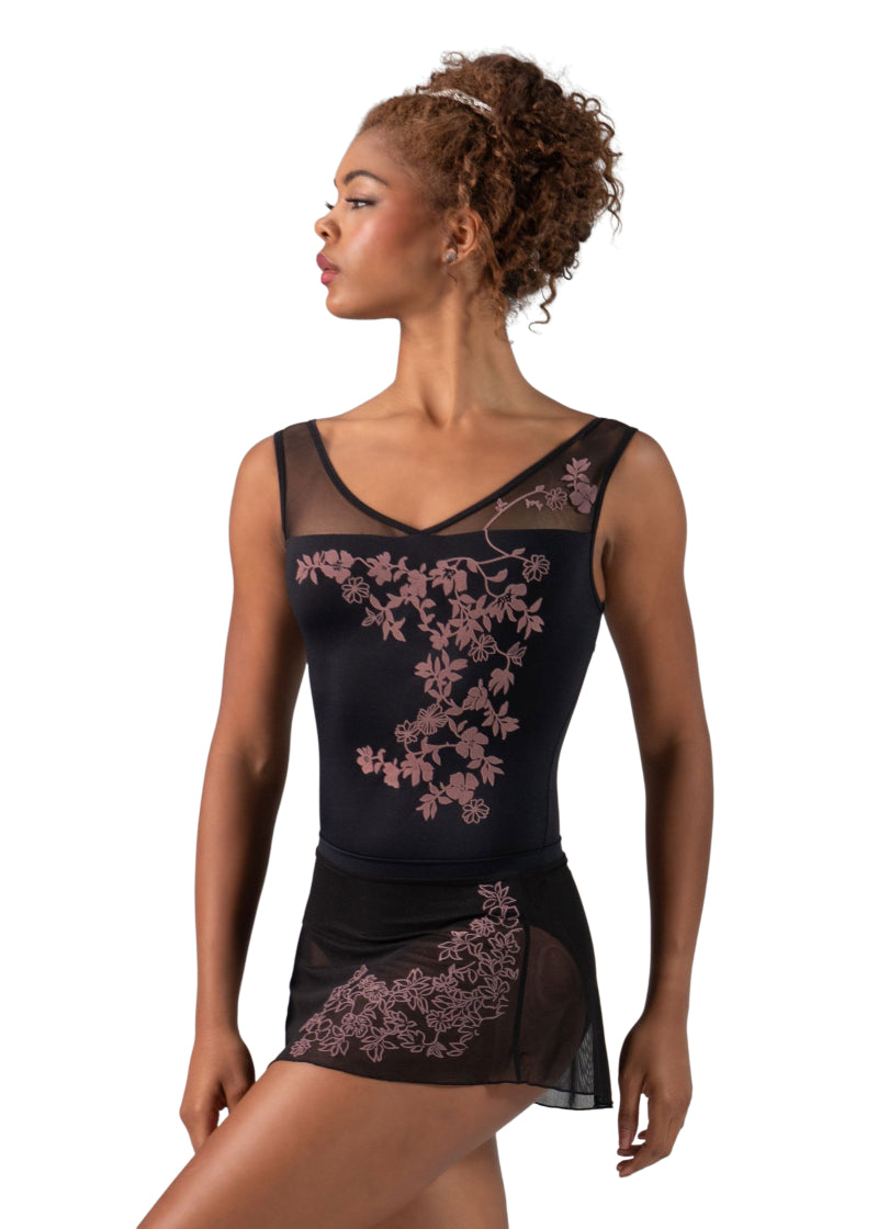 Ballet Rosa Createur Versailles Collection 1319MFA Women's Violette Floral Velour Print V-Neck Mesh Back Cut-Out Tank Leotard in Noir Black with Wild Rose Pink Velour Floral Print, shown on a ballet dancer wearing the matching Phoebe Skirt