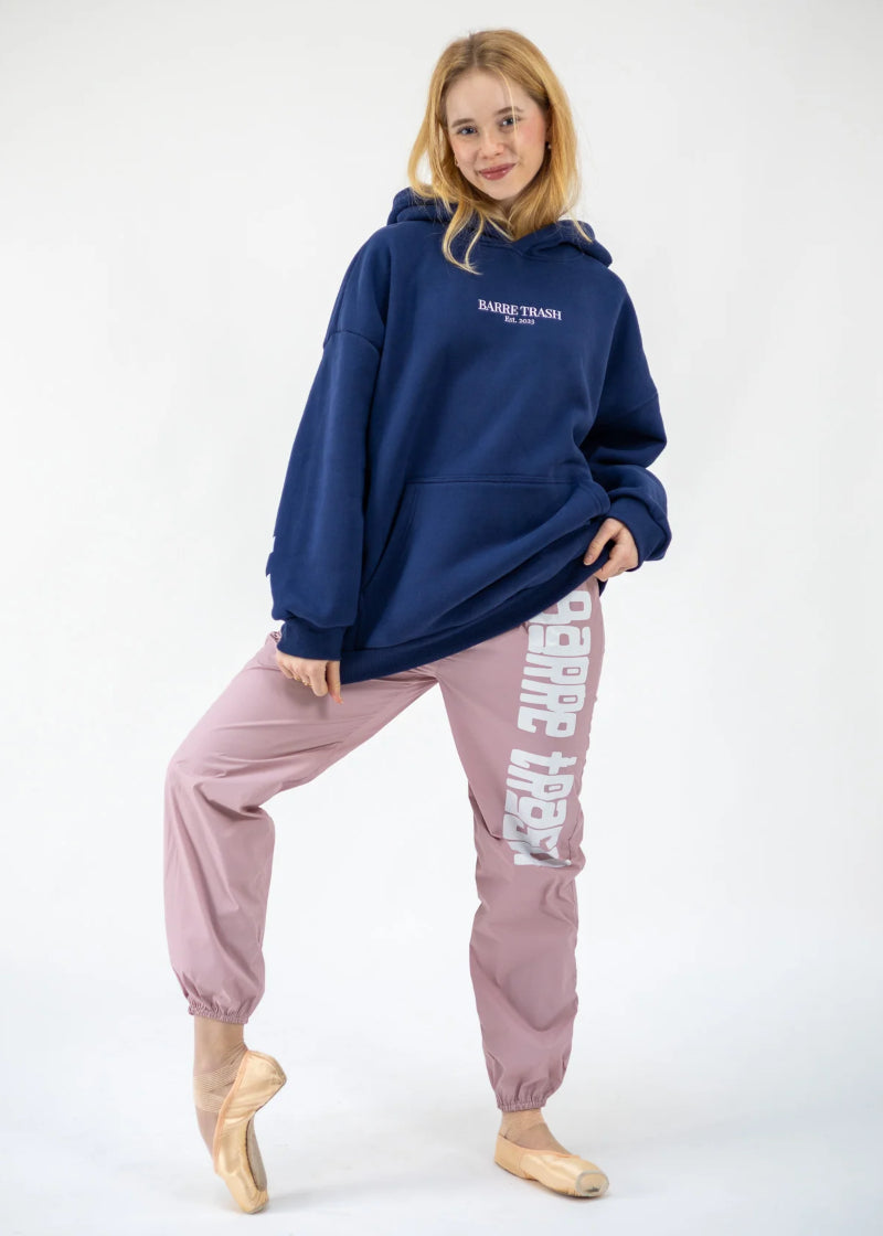 Barre Trash OH Women's Oversized Hoodie in Mariner Navy Blue with Barre Trash Est. 2023 embroidered in white on the front, modeled by a ballet dancer