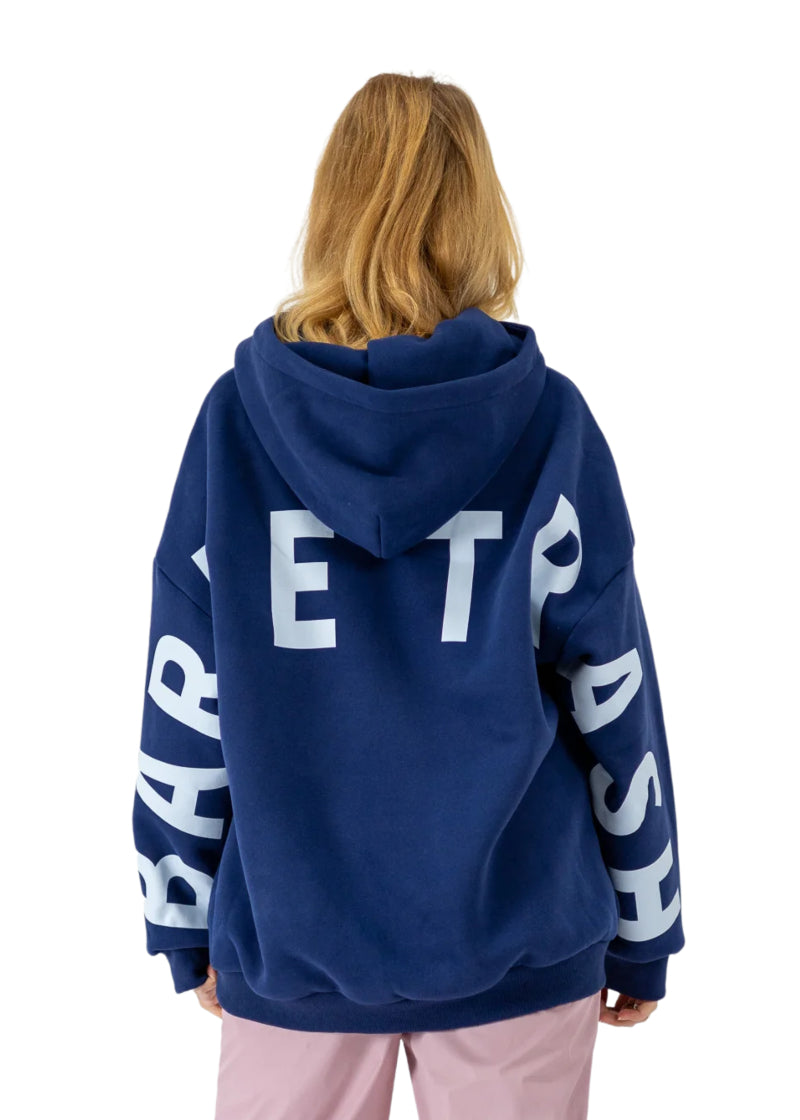 Barre Trash OH Women's Oversized Hoodie in Mariner Navy Blue with the Barre Trash logo in white lettering across the sleeves & back, modeled by a ballet dancer