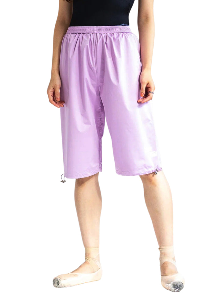 Barre Trash Women's Sauna Shorts in Lilac purple with adjustable drawstring leg openings and elastic waistband, modeled by a ballet dancer