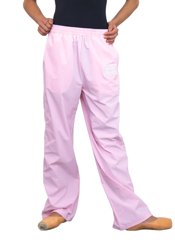Barre Trash TSP Tracksuit Pants in Ballerina Pink, modeled by a ballet dancer