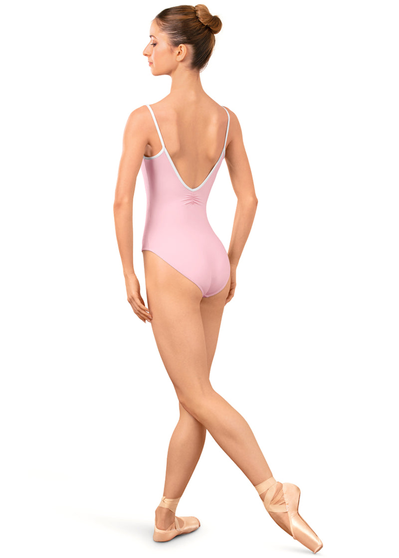 Bloch LB5261 Women's Arve Pinch V-Back Camisole Leotard in Carnation Light Pink with White Contrast Piping Detail, shown on a pointe dancer