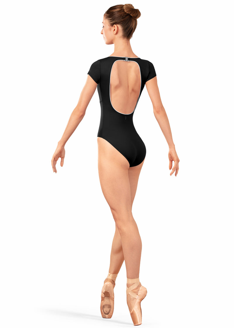 Bloch LB5262 Women's Alpheus Open Back Cut-Out with Clasp Clousure Cap Sleeve Leotard in Black with White Contrast Piping Detail, shown on a pointe dancer