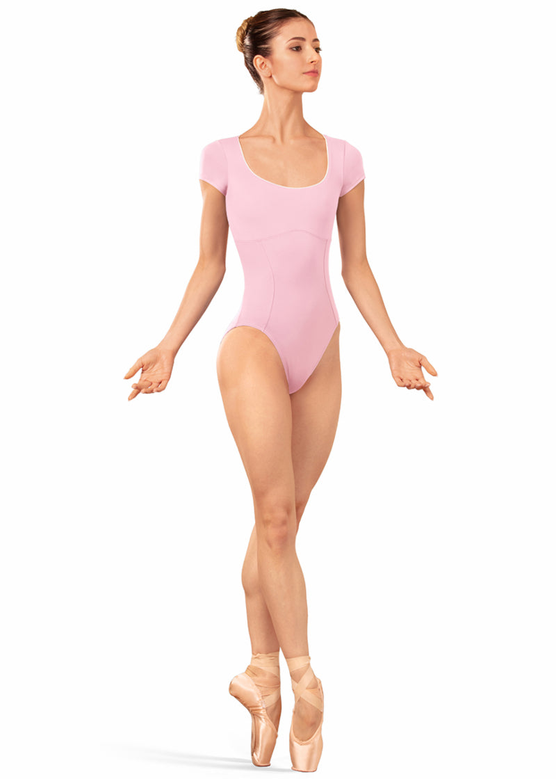 Bloch LB5262 Women's Alpheus Scoop Neck Princess Seam Cap Sleeve Leotard in Carnation Light Pink with White Contrast Piping Detail, shown on a pointe dancer