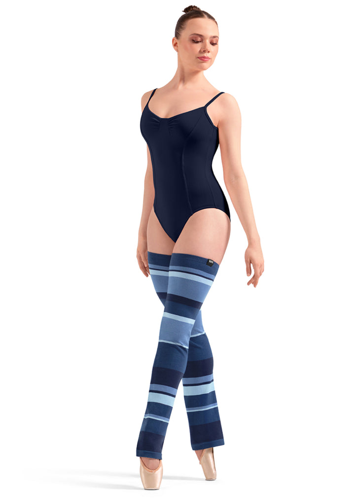 Bloch W11007 Women's Striped Thigh-High Legwarmers with Dark Blue, Medium Blue, and Light Blue Stripes with a relaxed fit ankle, shown on a pointe dancer