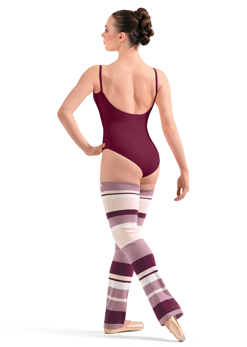 Bloch W11007 Women's Striped Thigh-High Legwarmers with Dark Pink, Light Pink, Peach, and Cream-colored Stripes with a relaxed fit ankle, shown on a pointe dancer