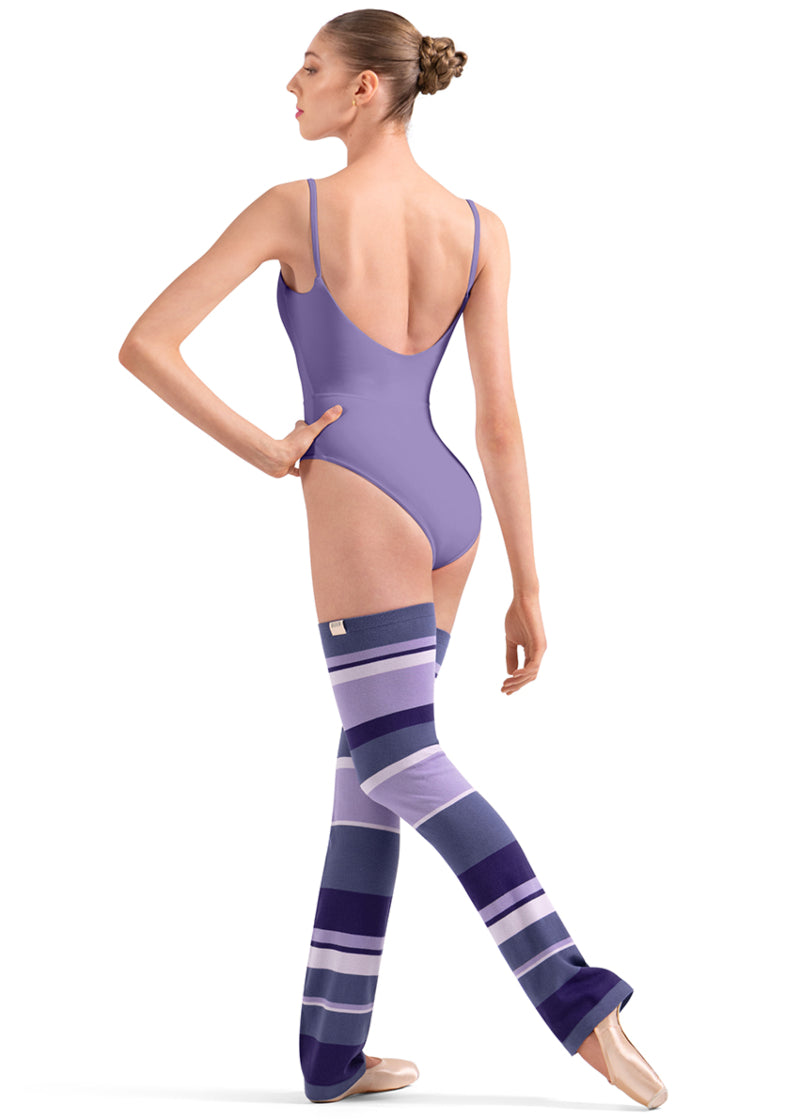 Bloch W11007 Women's Striped Thigh-High Legwarmers with Dark Purple, Grape, Lilac, and cream-colored Stripes with a relaxed fit ankle, shown on a pointe dancer