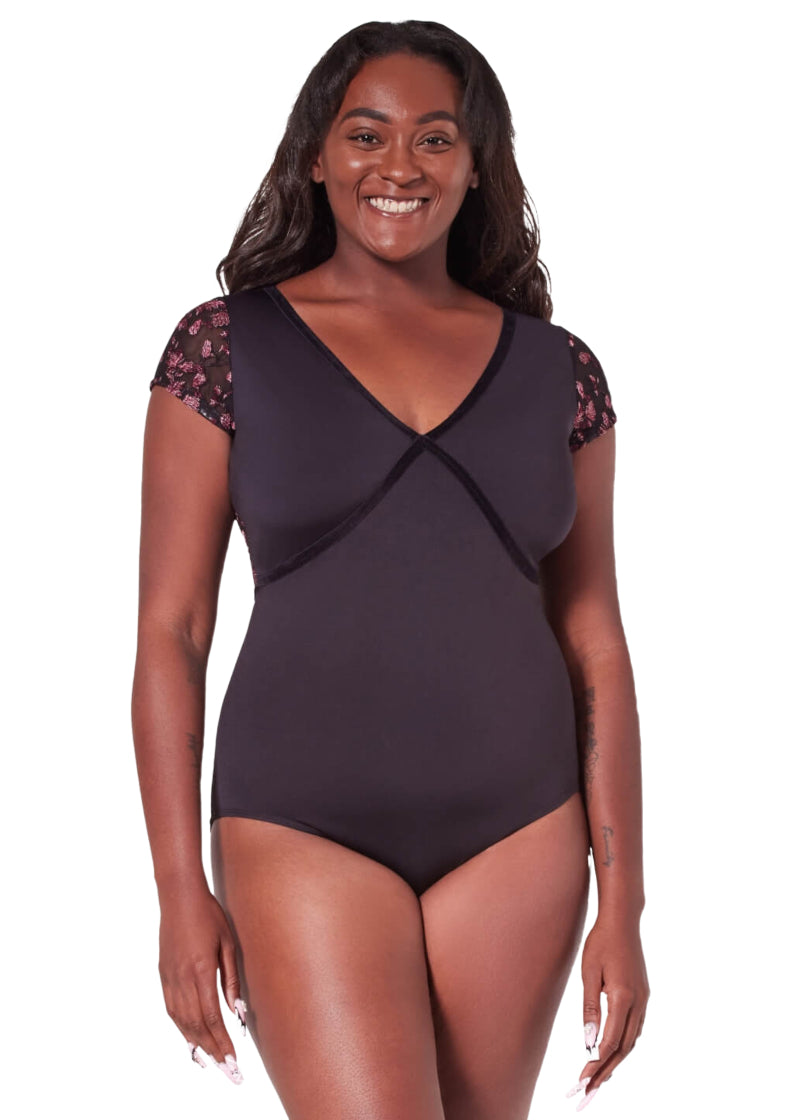 Capezio women's Fascination short sleeve leotard in black with velvet bust trim and floral embroidered mesh sleeves.