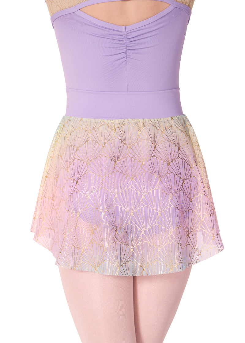 Capezio youth Sand Dollar pull-on skirt with light purple pinch front waistband, light purple, yellow, and pink color gradient, and shiny gold seashell print.