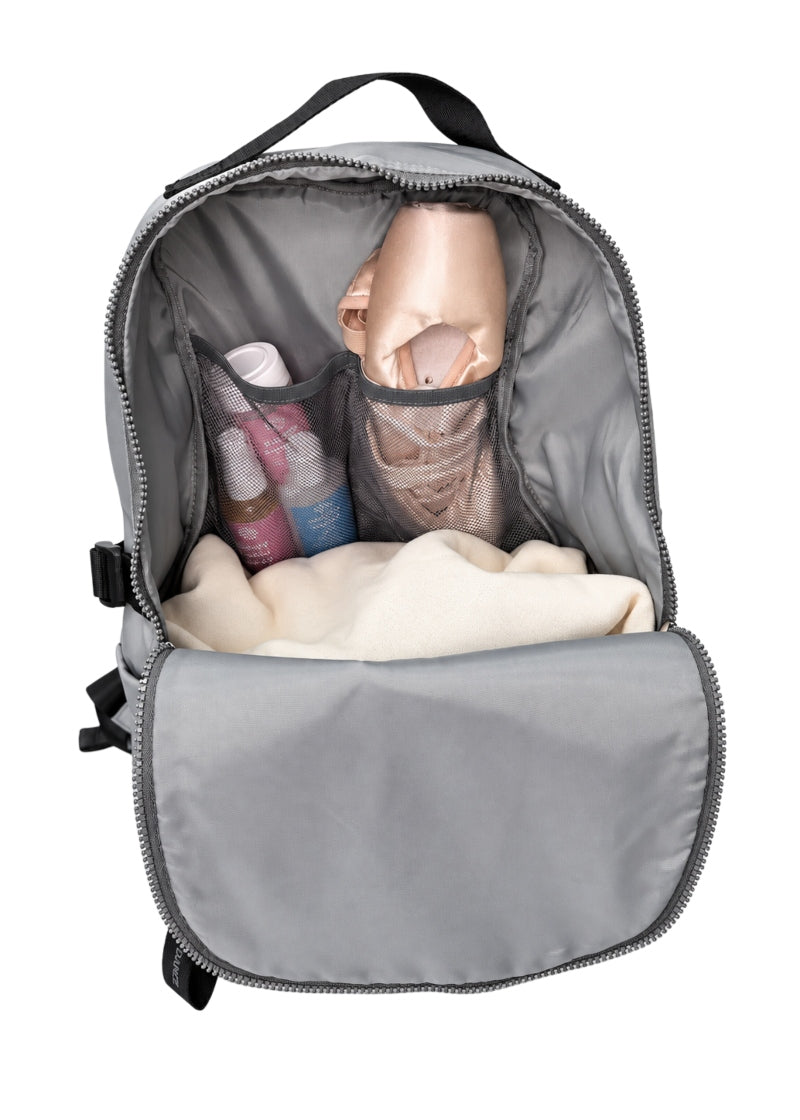 Interior view of Covet Dance Bravo Backpack with multiple pockets and adjustable straps in Gray