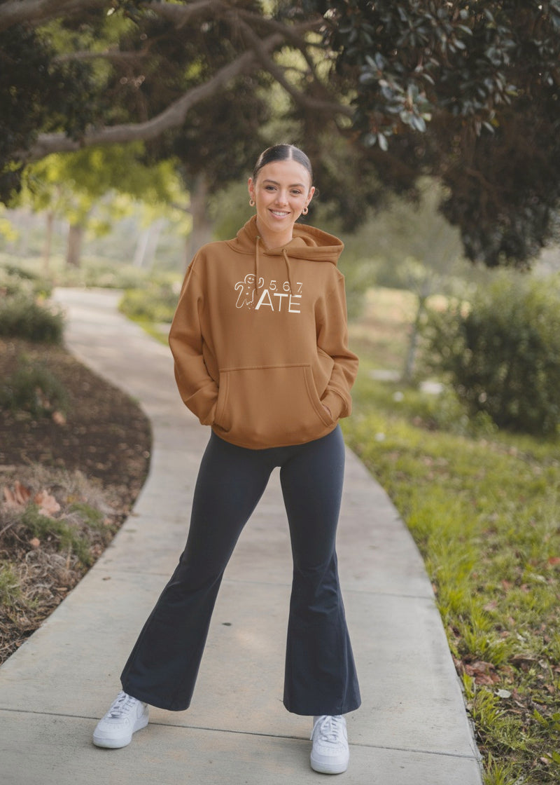 Covet Dance_567-HD_5, 6, 7, ATE Gingerbread Women's Hoodie with Front Pouch Pocket in a warm medium brown, shown on a dancer wearing jazz pants in a park