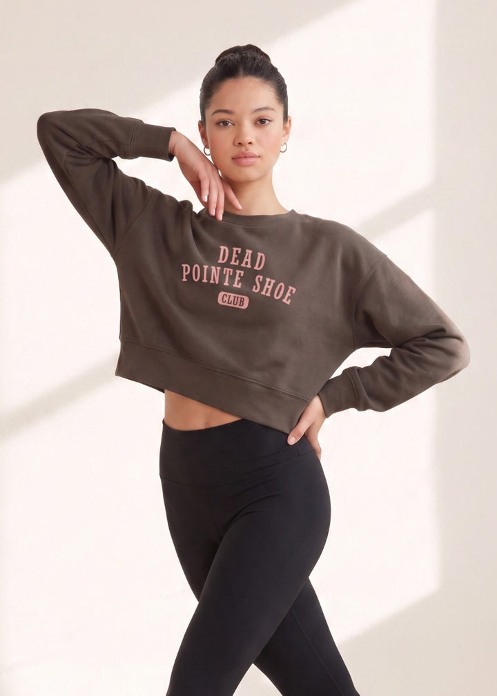 Covet women's crop sweatshirt in brown with pink "dead pointe shoe club" text.