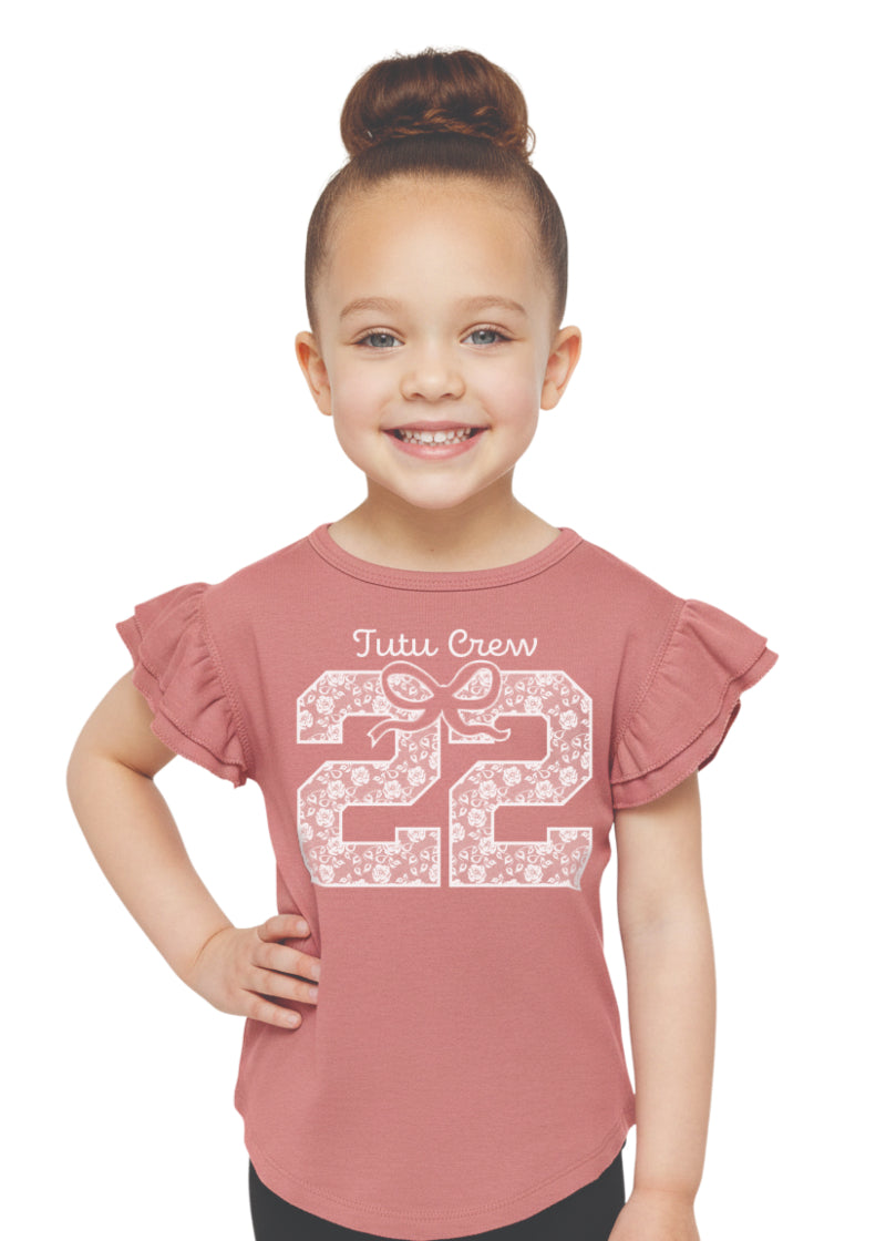 Covet Dance 22C-TOD Girls' 22 Tutu Crew Flutter Sleeve Tee in Pink, shown on a smiling young dancer