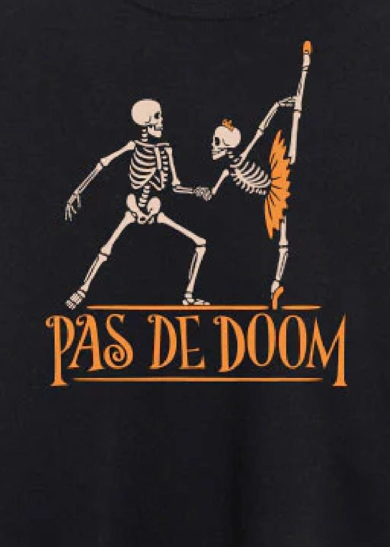 Covet Dance PDD-SS Women's Pas de Doom Halloween Sweater in Black, with a print of two skeletons dancing a pas de deux together with the words "Pas de Doom" printed in orange underneath