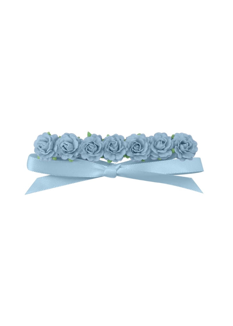 Seven light blue flowers in a row, attached to a matching light blue ribbon.