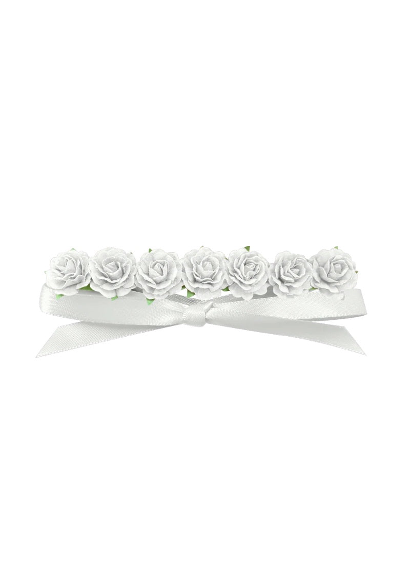 White flowers attached to white ribbon.