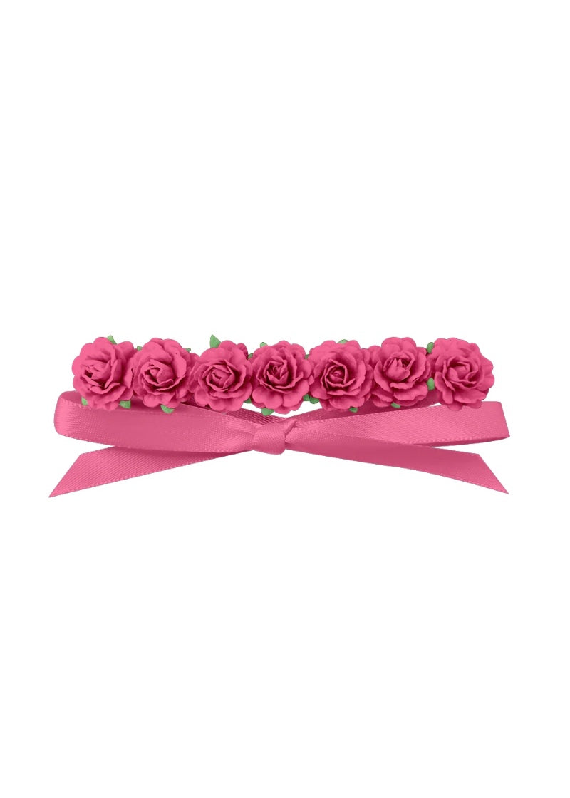 Pink flowers attached to pink ribbon.