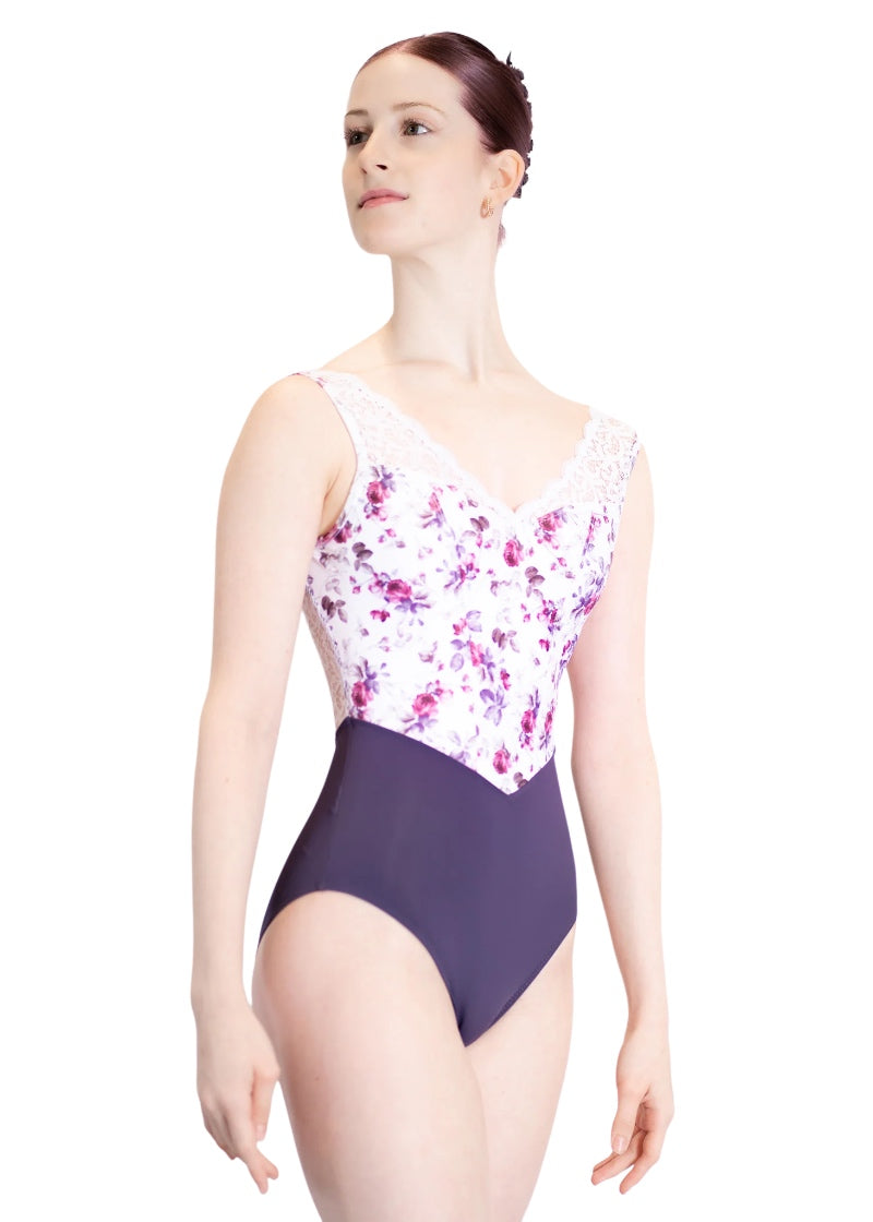 Danse de Paris women's Demi Moulin tank leotard with white lace v-neckline, pink and purple floral print on white bodice with princess seams, and purple bottom with v-waistline.