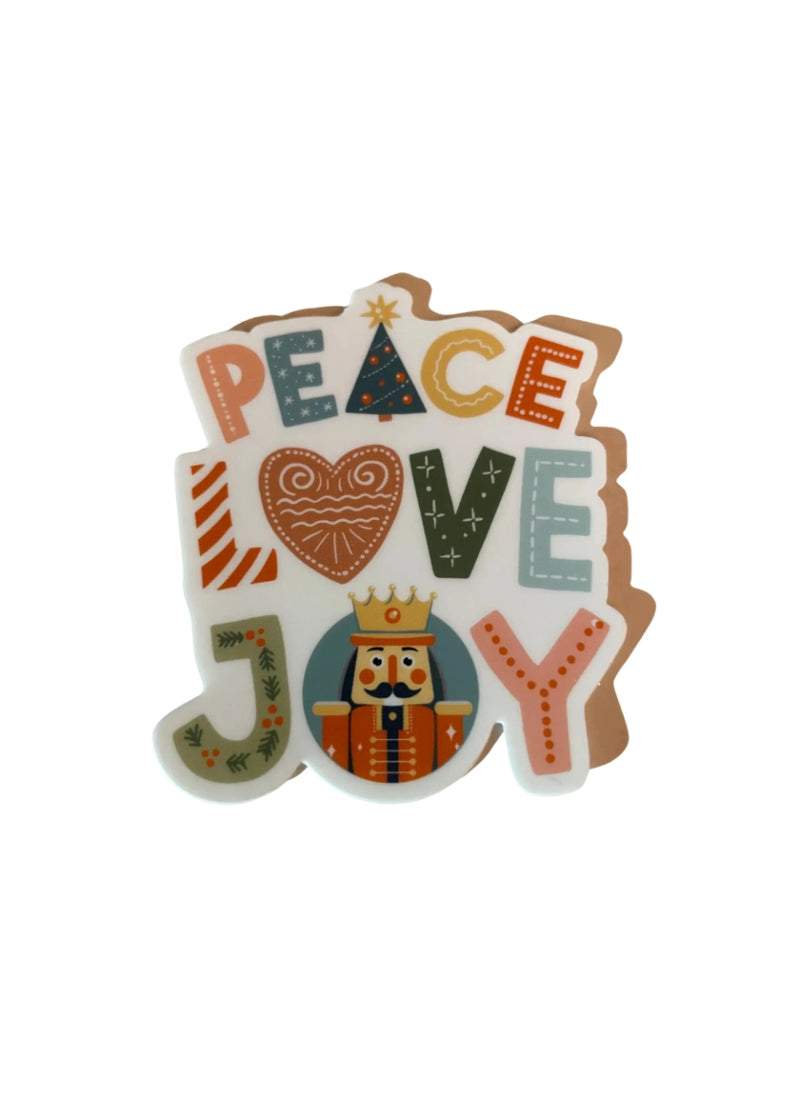 Peace Love Joy text in various festive colors, with nutcracker in the O.