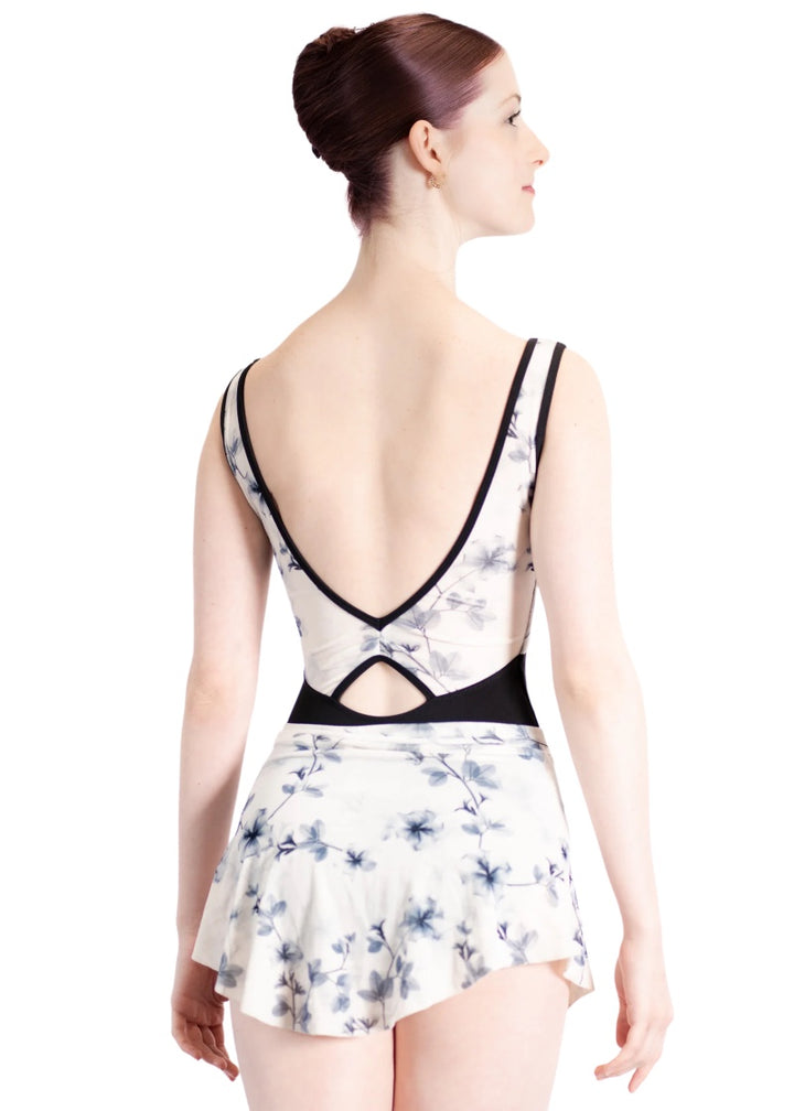 Danse de Paris women's high-low pull-on skirt in white velvet with blue floral print.