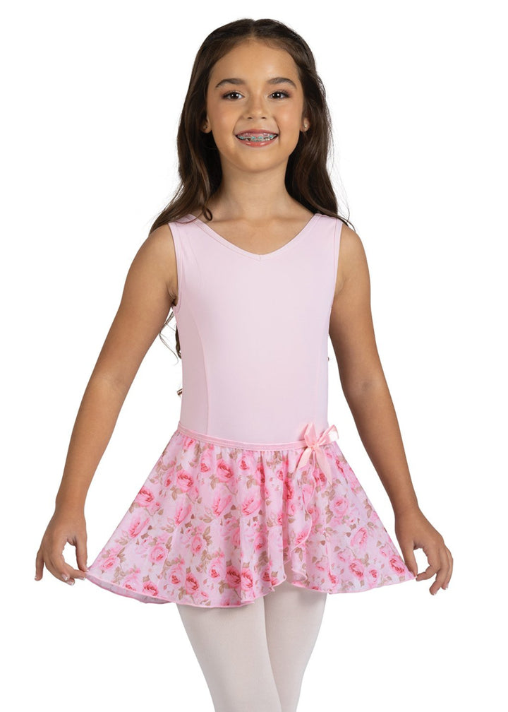 Danznmotion by Danshuz 25404C Girls' Rosetta Rose Floral Print Mock Wrap Georgette Youth Pull-On Skirt in Pink Pastel, shown on a young girl wearing a matching light pink leotard