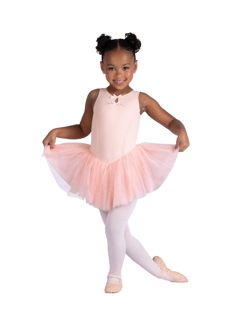 Danznmotion youth tank dress in light pink with princess seams, two bows attached at keyhole neckline, and full mesh attached skirt.