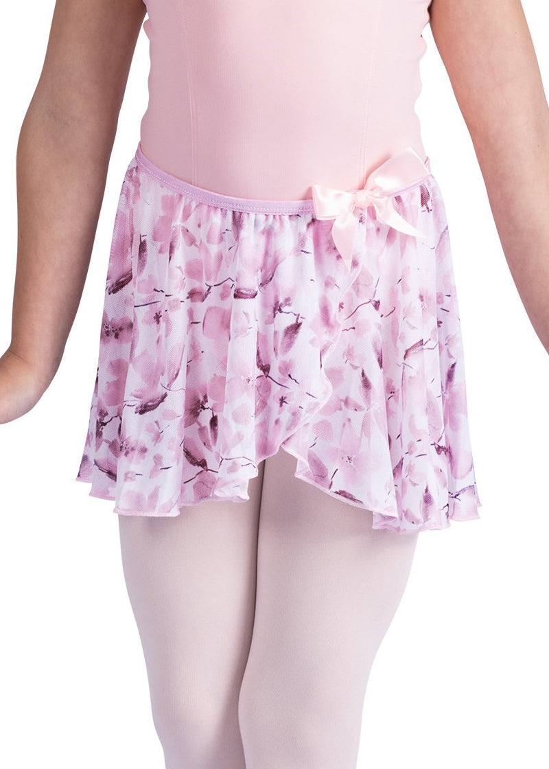 Danznmotion by Danshuz 26407C Girls' Meadow Floral Mock Wrap Georgette Youth Pull-On Skirt in Pink, shown on a young girl wearing a matching light pink leotard